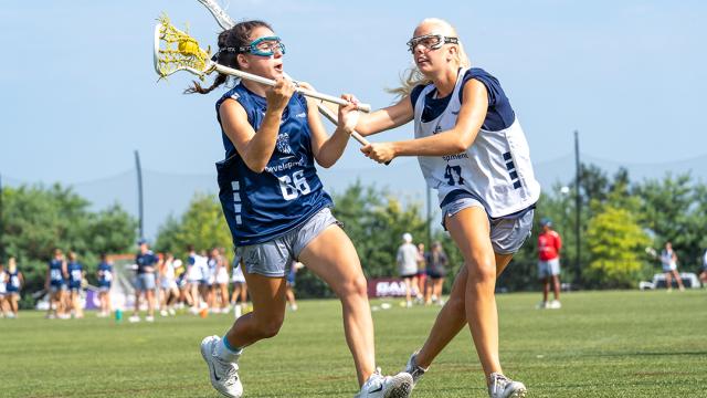 Presley Upton guards Adriana Gromelski during the USA Lacrosse girls national combine in July 2025