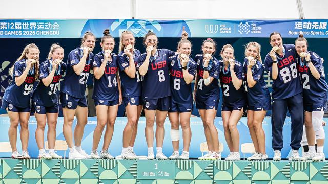 The U.S. women's lacrosse team stands on the platform after receiving their gold medals at The World Games in 2025