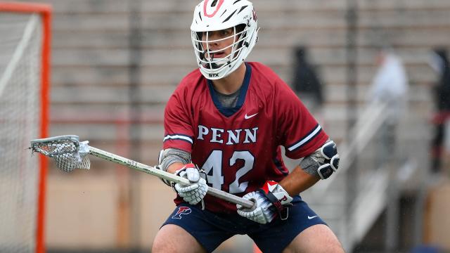 Penn defender Ryan Sullivan crouches down in his defensive stance