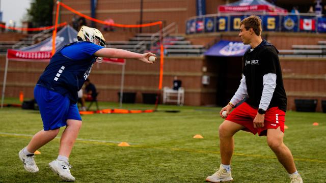 Colin Kirst plays hot potato with a young goalie