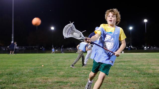 A youth player at a National Celebrate Lacrosse Week clinic in St. Louis in 2024