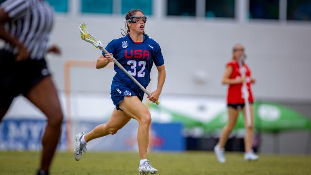Sydney Scales runs up the field with the ball