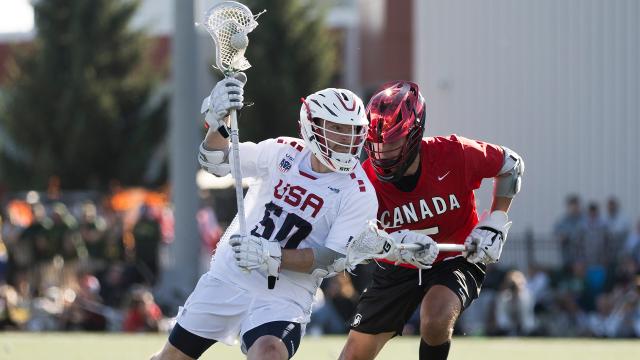 Chris Kavanagh cradles the ball against Canada during the Super Sixes competition.