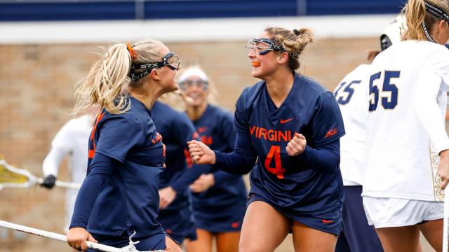 Virginia women's lacrosse player Jenna DiNardo celebrates after scoring