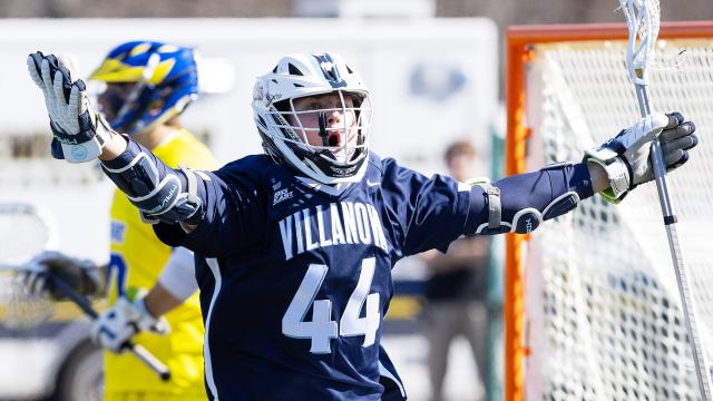 Luke Raymond raises his arms after a goal against Delaware
