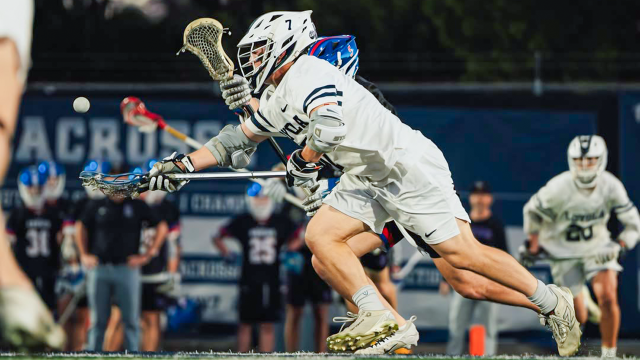 Andrew Goldman of Loyola-Los Angeles (Calif.) lacrosse wins a faceoff against Cherry Creek (Colo.)