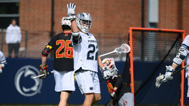 Chase Robertson raises his arm in the air after a goal against Maryland.