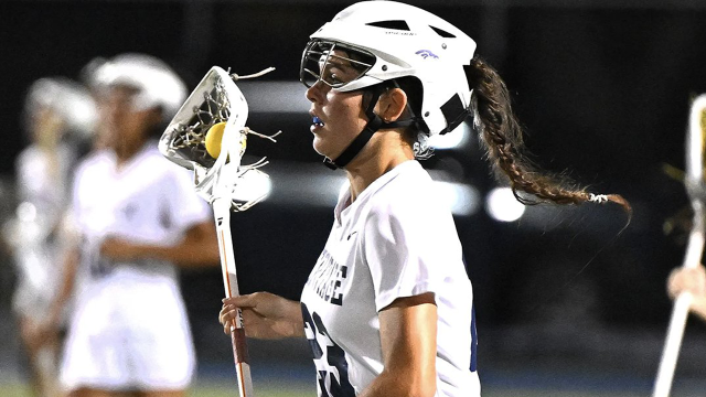 Emma Switter of American Heritage-Delray (Fla.) girls' lacrosse running with the ball