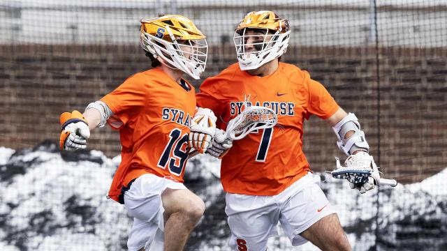 Wyatt Hottle and Michael Leo celebrate a Syracuse goal in a comeback win at Penn.