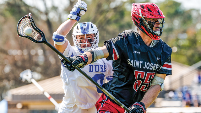 Kyle Colsey of Duke looks to execute a trail check on the ride against a Saint Joseph's defenseman during a game earlier this year