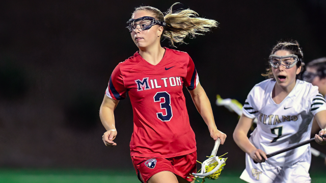 Kylie Waters of Milton (Ga.) girls' lacrosse carries the ball in her stick while running up the field