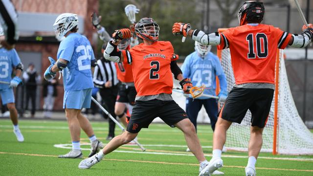 Princeton's Nate Kabiri flexes after a goal against North Carolina