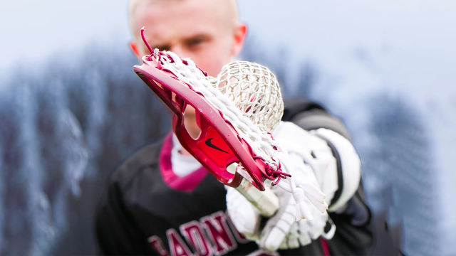 Photo of Radnor (Pa.) High School boys' lacrosse player pointing stick at camera