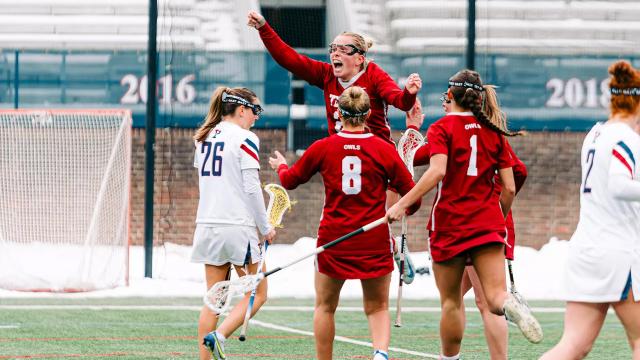 Temple women's lacrosse celebrates against Penn