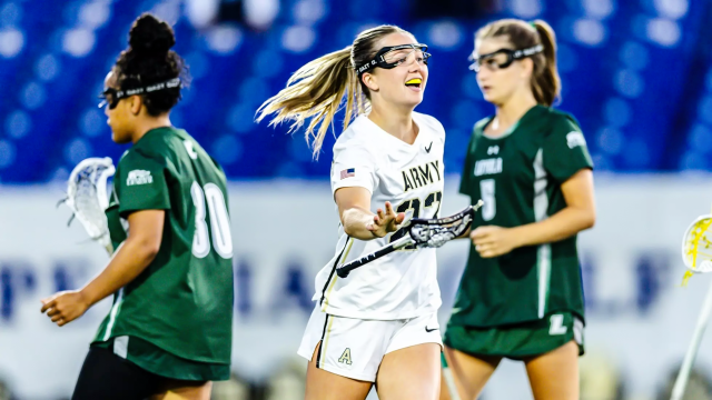 Allison Reilly tosses her stick after one of her six goals in Army's win over Loyola in the Patriot League semifinals at Navy