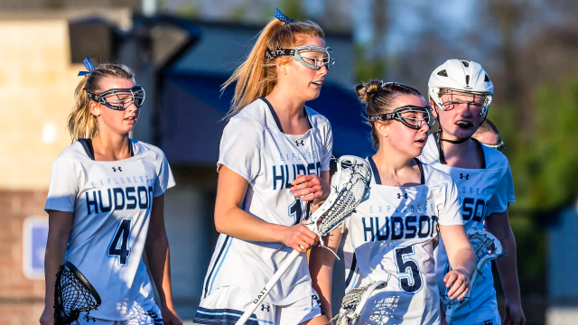 Hudson (Ohio) girls' lacrosse players after a goal