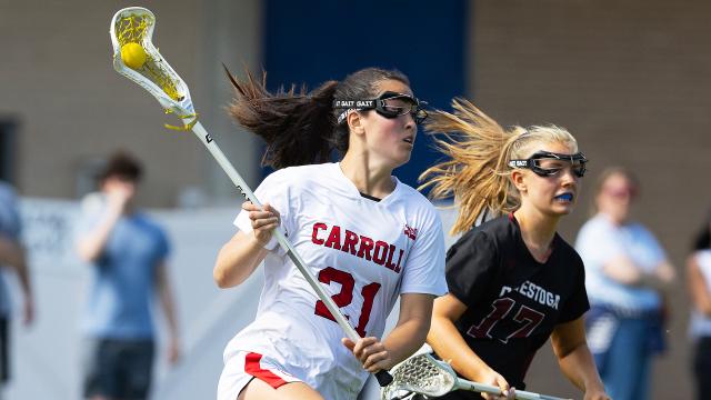 Archbishop Carroll's Kallee Clark carries the ball against Conestoga earlier this season in girls' lacrosse.