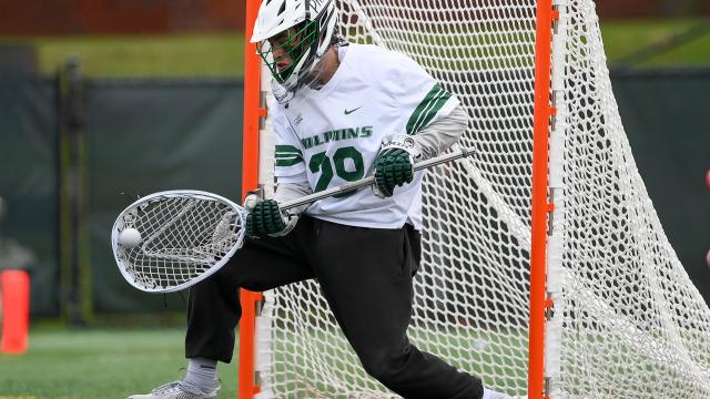 Lucas Winger makes a save for Le Moyne