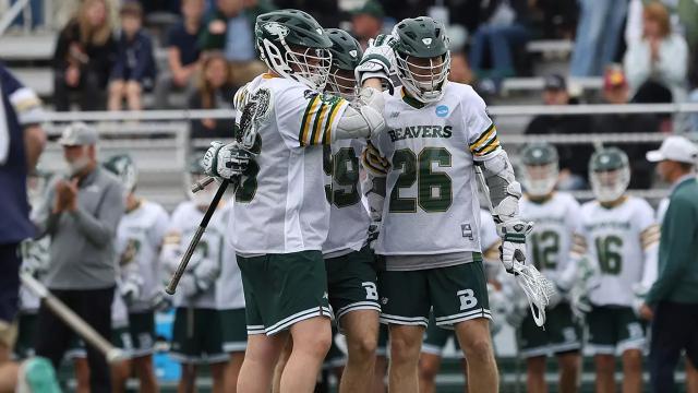 Babson men's lacrosse players huddle