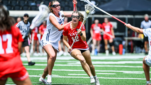 Davidson women's lacrosse player Brooke Ross weaving inside of Richmond's defense in the Atlantic 10 semifinals