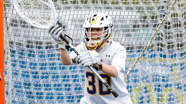 Goalie Dakota Acello of Lake Forest (Ill.) girls' lacrosse awaits a shot on goal.
