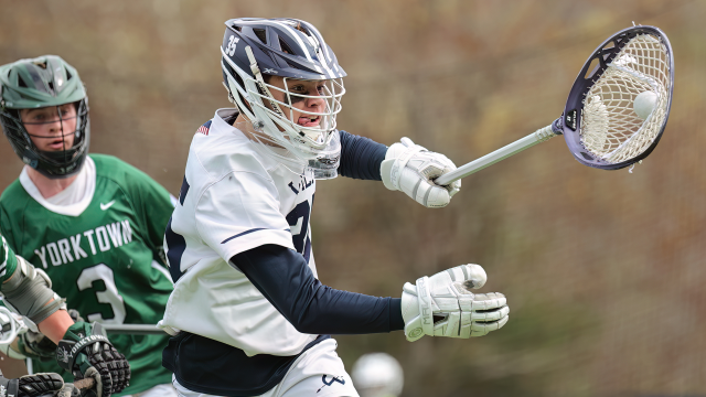 Wilton (Conn.) goalie Trevor Galligan cradling the ball up the field
