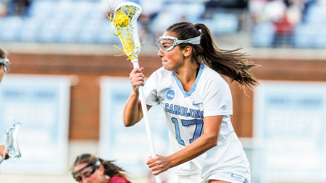 North Carolina women's lacrosse player Kayleigh Harden carries the ball in her stick during an NCAA quarterfinal game against Stanford in Chapel Hill, N.C.