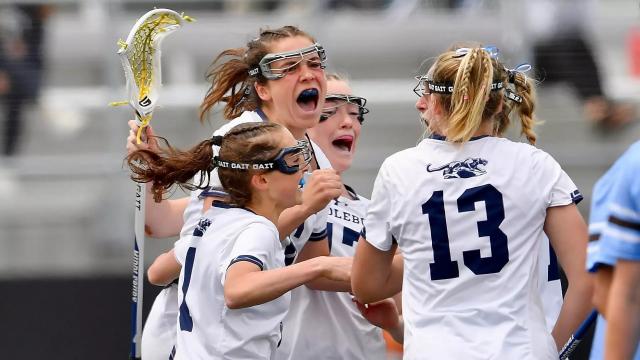 Middlebury players congregate during their semifinal victory over Tufts