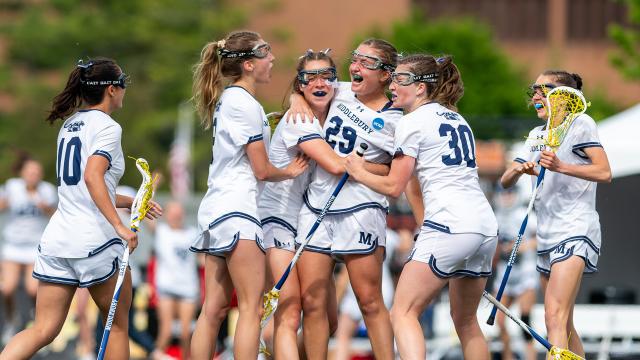 Middlebury players celebrate a goal during their national championship win over Wesleyan