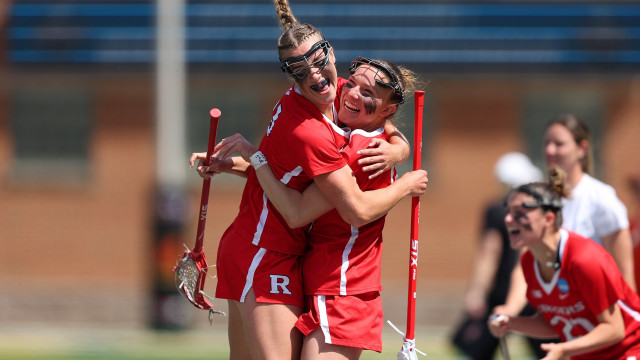 Rutgers players hug after a goal during their NCAA victory over Princeton