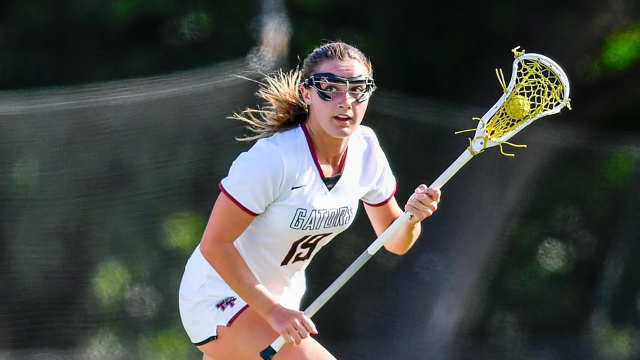 Sacred Heart Prep (Calif.) girls' lacrosse player with ball in stick