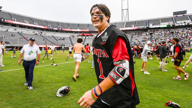 OT hero Tommy Ortega basks in the post-game celebration at Scott Stadium after Tampa's victory over Adelphi in the NCAA DIvision II championship game in Charlottesville, Va.