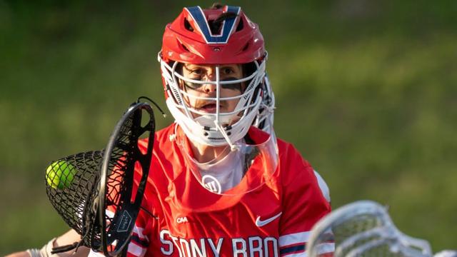 Tommy Wilk stands in goal leading Stony Brook to an upset win over Towson