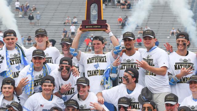 Tufts with the NCAA trophy
