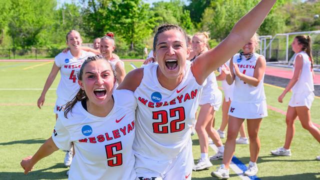 Wesleyan's Lindsey Diomede and Lilly Stoller yell to the camera following a NCAA tournament win.
