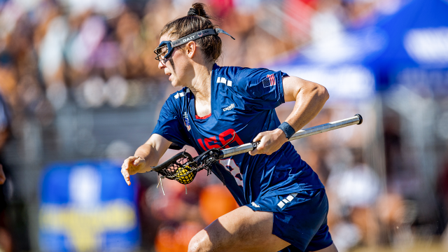 Charlotte North running with ball in stick at the 2025 Pan-American Women's Lacrosse Championship in Florida