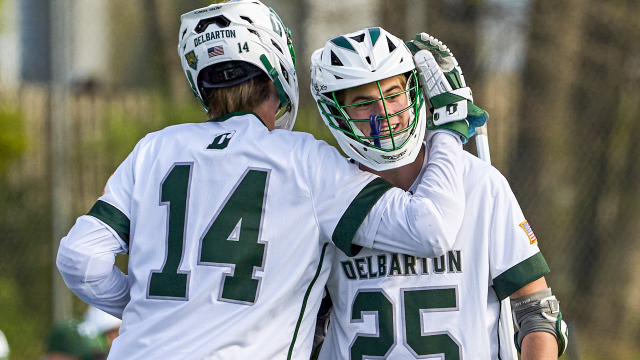 Two Delbarton (N.J.) lacrosse players embrace to celebrate after a goal.