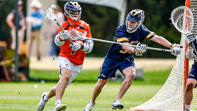 Virginia men's lacrosse attackman Brendan Millon distributes the ball in a game against Drexel