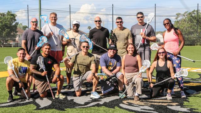 Members of Los Cocodrilos, a group of lacrosse players stationed at Guantanamo Bay, Cuba
