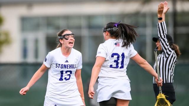 Stonehill women's lacrosse celebration after a goal in the NEC semifinals at Le Moyne