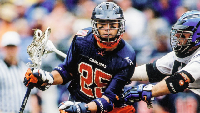 Virginia midfielder Chris Rotelli dodges a Johns Hopkins defender in the 2003 NCAA championship game at M&T Bank Stadium in Baltimore.