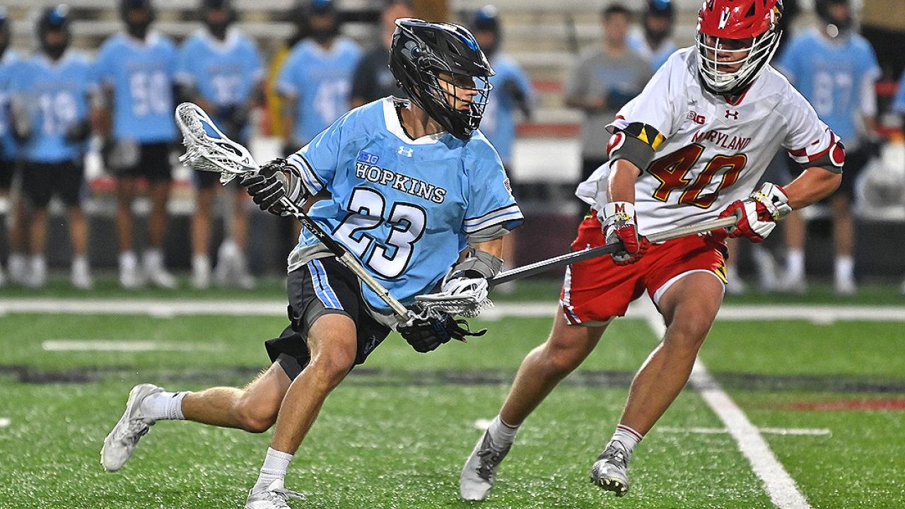 Johns Hopkins magical season continued with a 12-11 win at Maryland on Saturday night. Jacob Angelus had a hat trick in the victory.