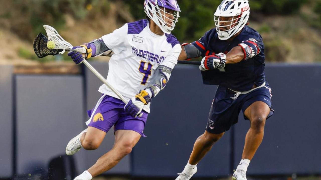 JT Giles-Harris defends Lyle Thompson during a World Lacrosse Men's Championship pool play game Saturday at the University of San Diego's Torero Stadium.