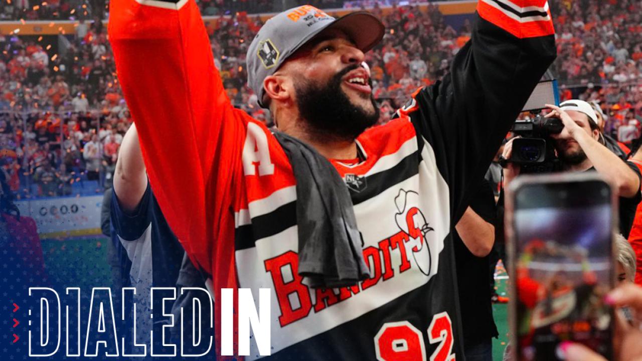 Dhane Smith hoists the NLL championship trophy as the Buffalo Bandits celebrate for the first time since 2008.