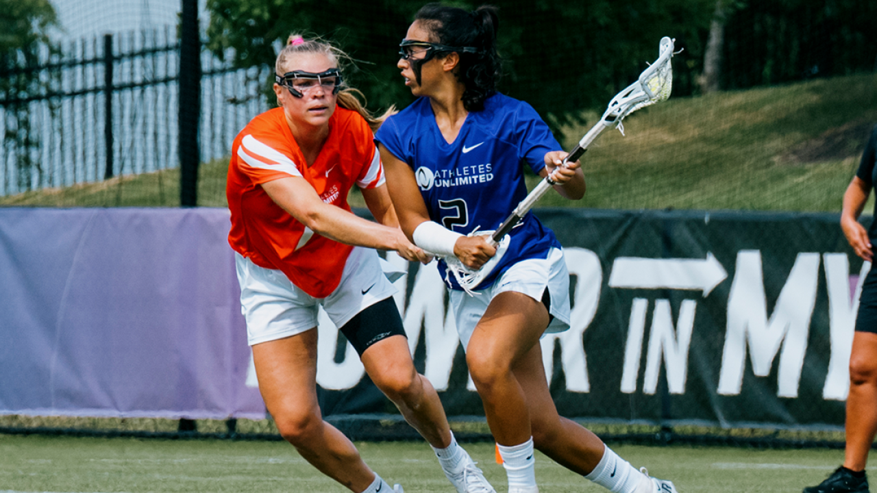 Dempsey Arsenault defends Izzy McMahon during Athletes Unlimited Lacrosse season three.