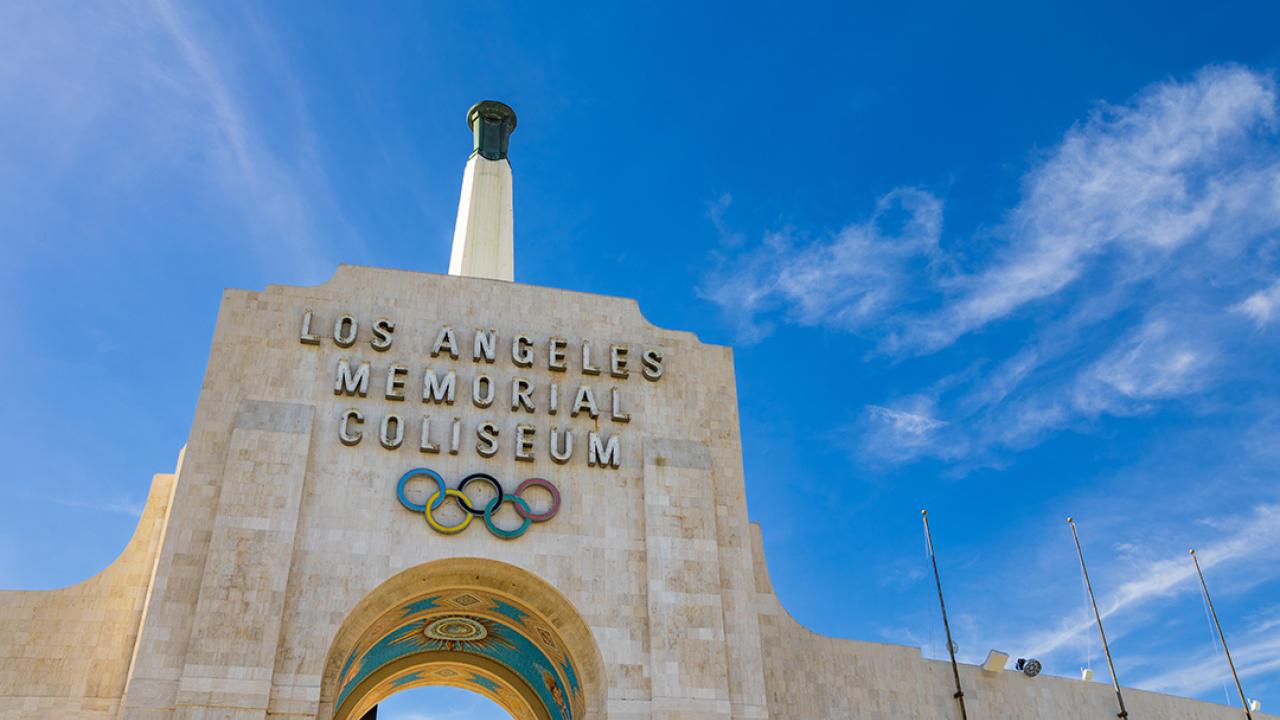 The Los Angeles Memorial Coliseum and Olympic torch.