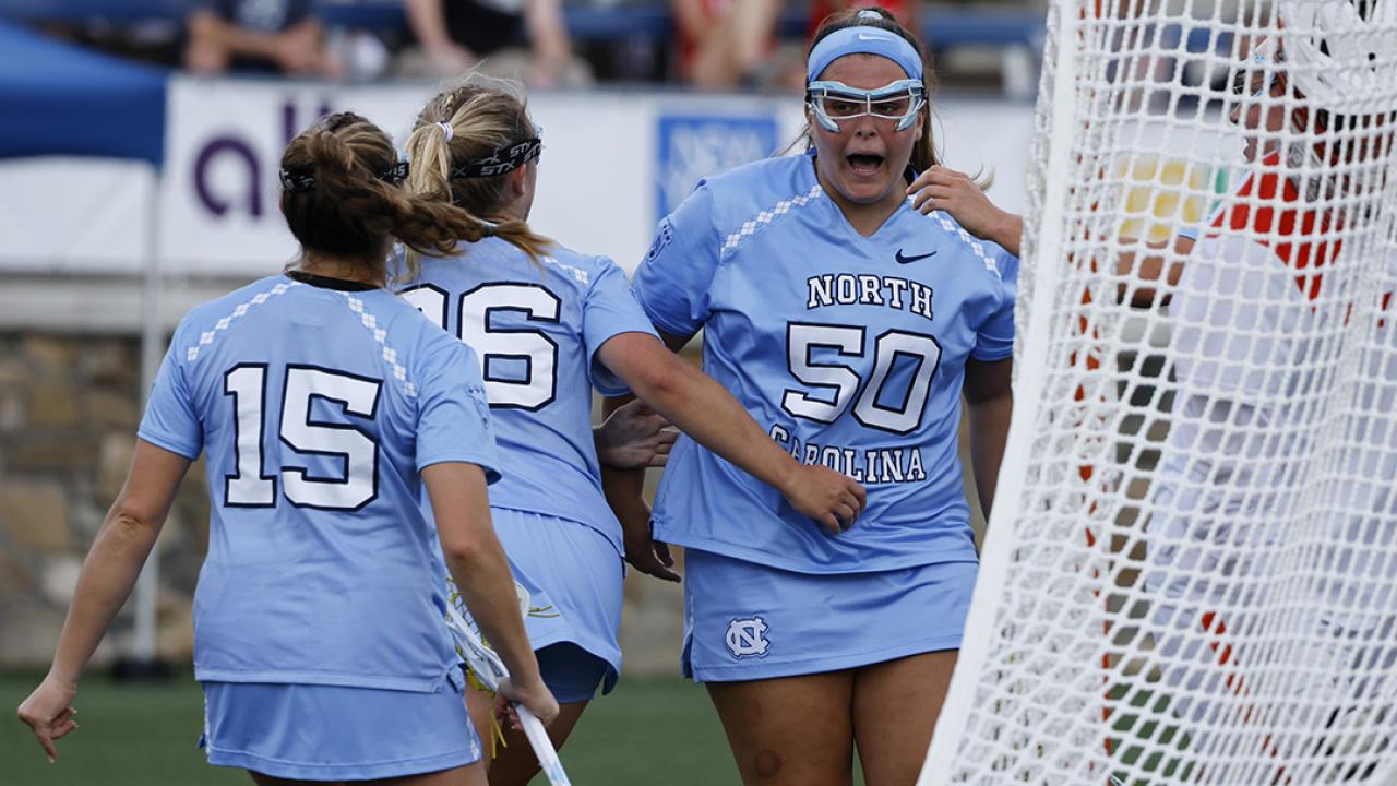 Caitlyn Wurzburger and Caroline Godine celebrate with Melissa Sconone after an early goal as part of UNC's eight-goal spurt to open the game.