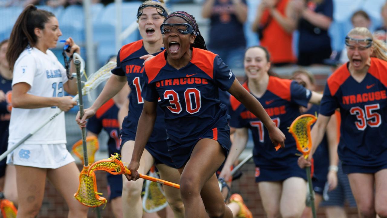 Superia Clark celebrates Syracuse's 14-12 win over North Carolina at Dorrance Field.