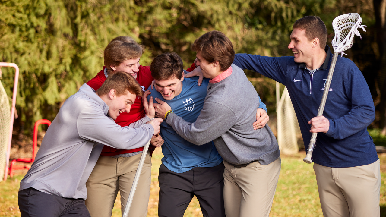 From left, CJ, Caden, Cole, Colin and Connor Kirst rough house in the family's backyard in Bernardsville, New Jersey.