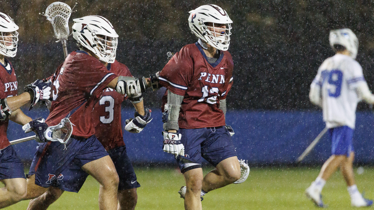 Penn men's lacrosse celebrates a goal against Duke.